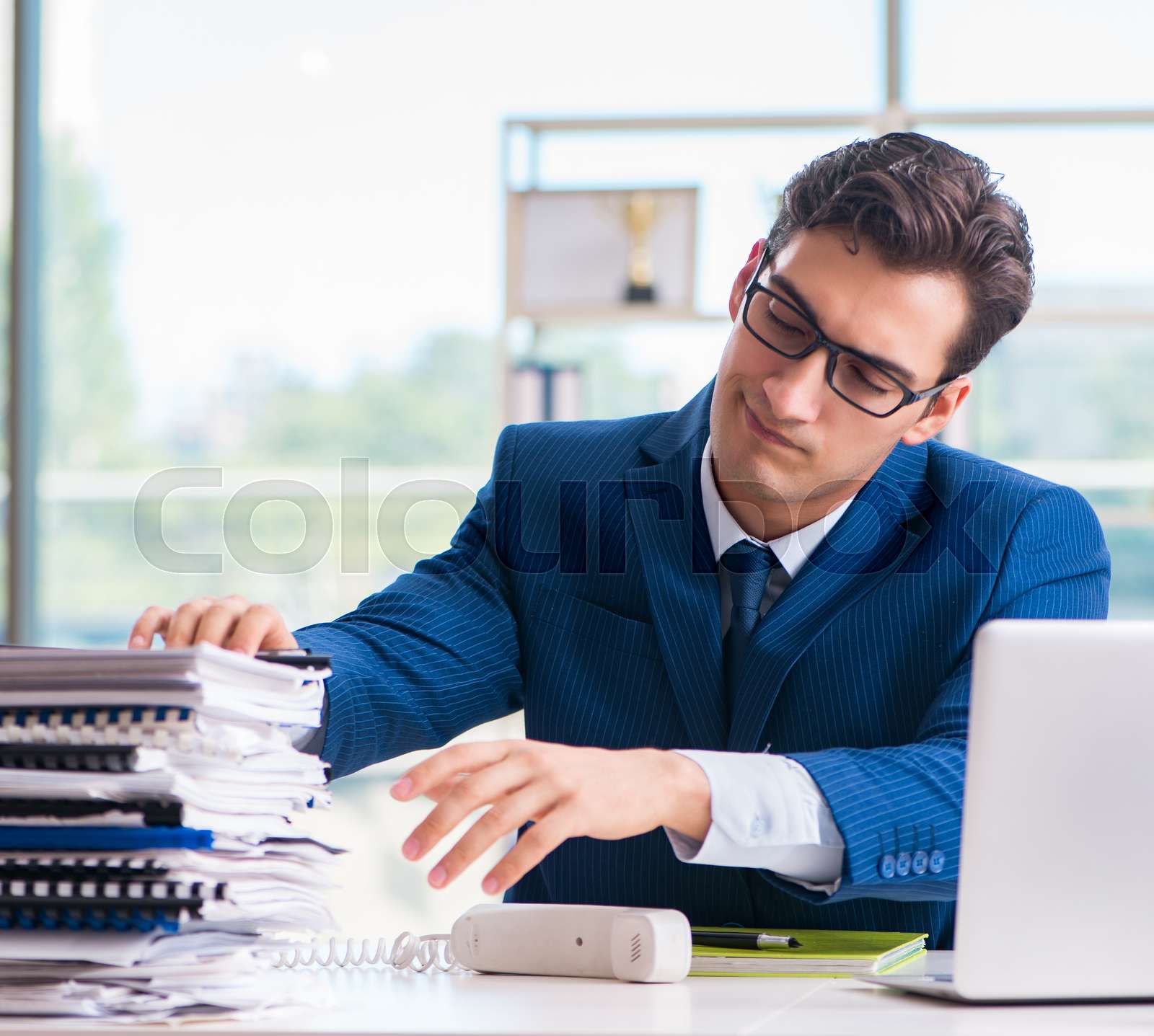 The businessman working in the office | Stock image | Colourbox