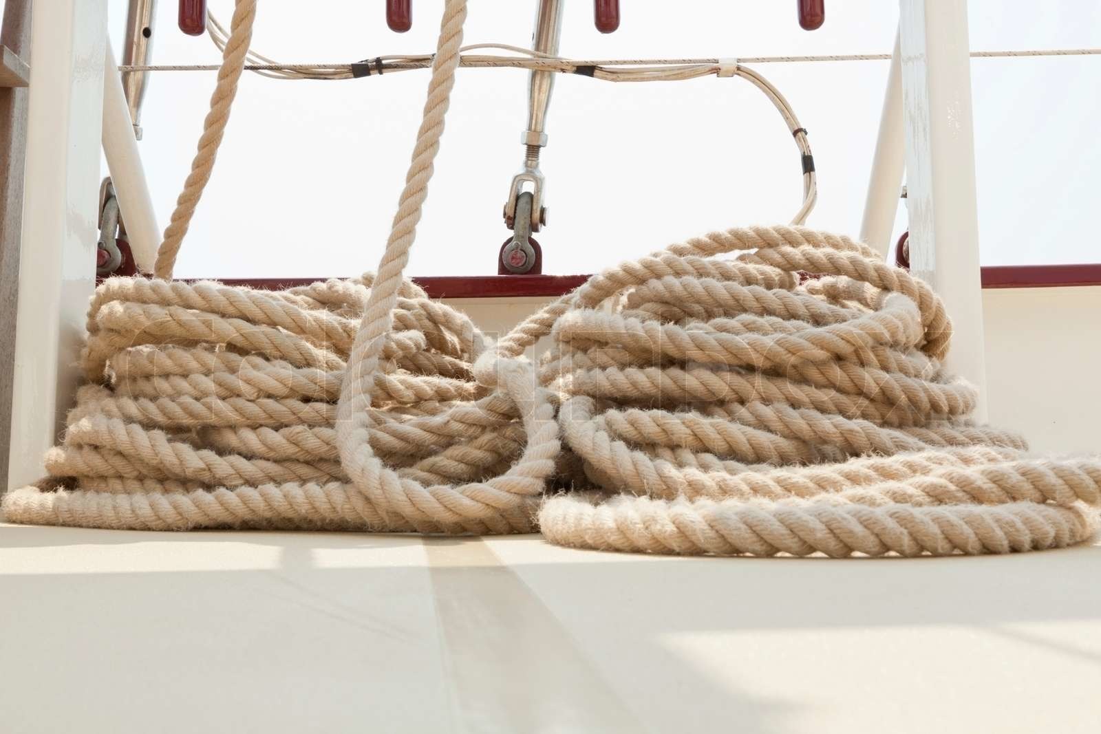 Coiled rope rigging on a sailboat deck | Stock image | Colourbox