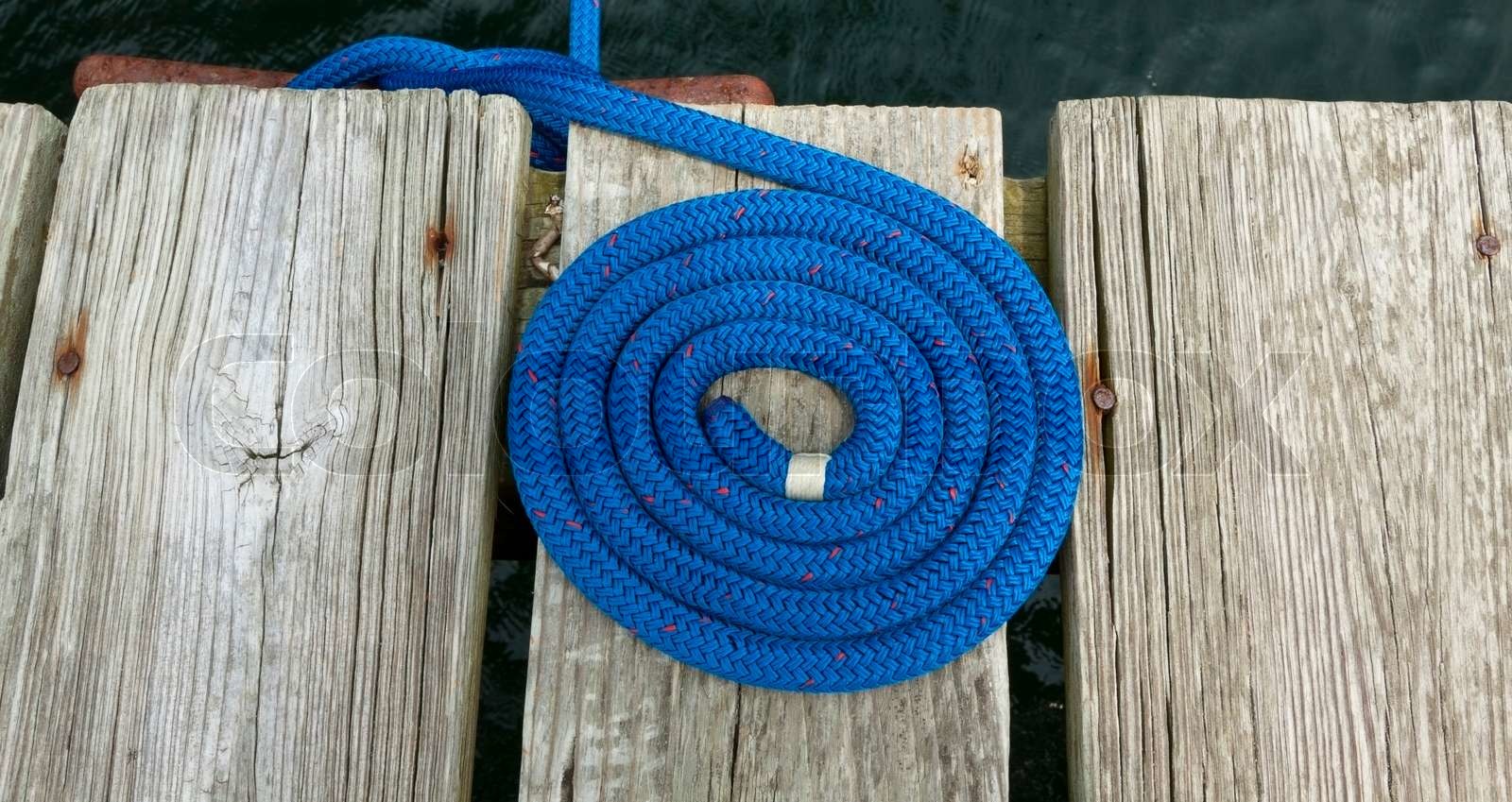 Coiled rope rigging on a jetty | Stock image | Colourbox