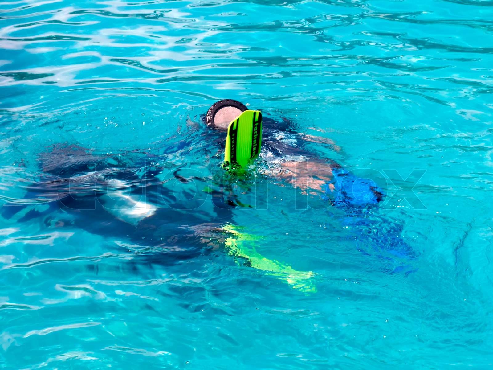 A boy taking scuba diving lessons in the caribbean resort Stock image