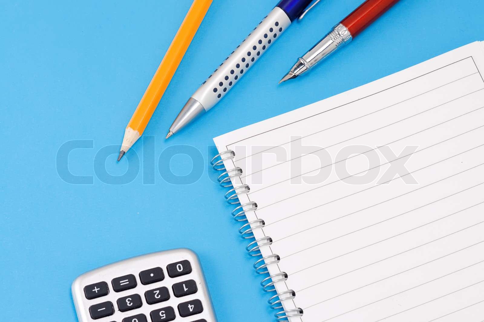 pen, pencil and calculator with pad | Stock image | Colourbox