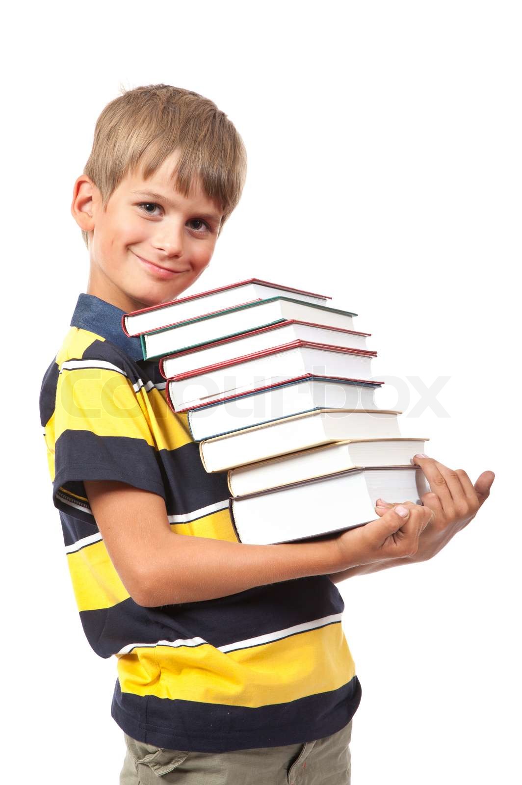 School boy is holding books | Stock image | Colourbox