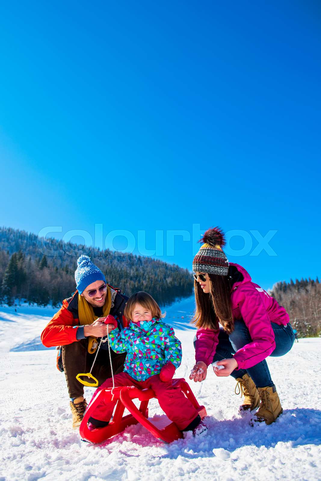Happy Family In Snow Riding On Sledge. | Stock image | Colourbox