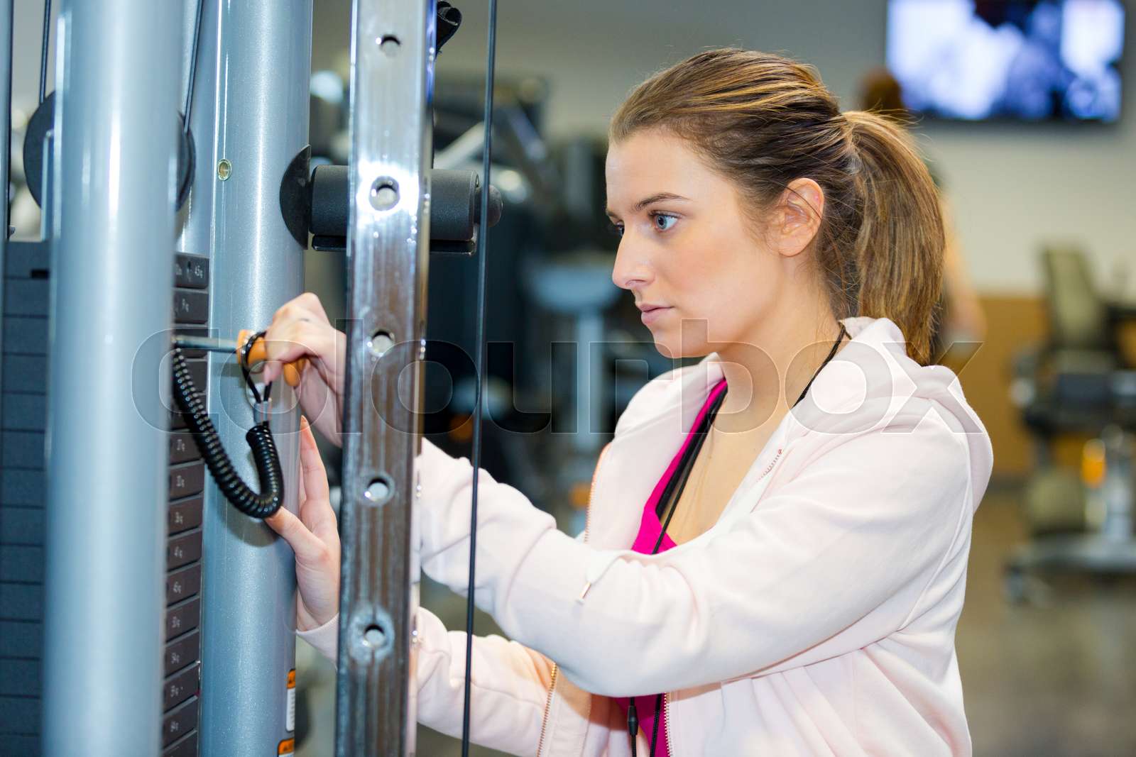 fitness woman working out in fitness center | Stock image | Colourbox