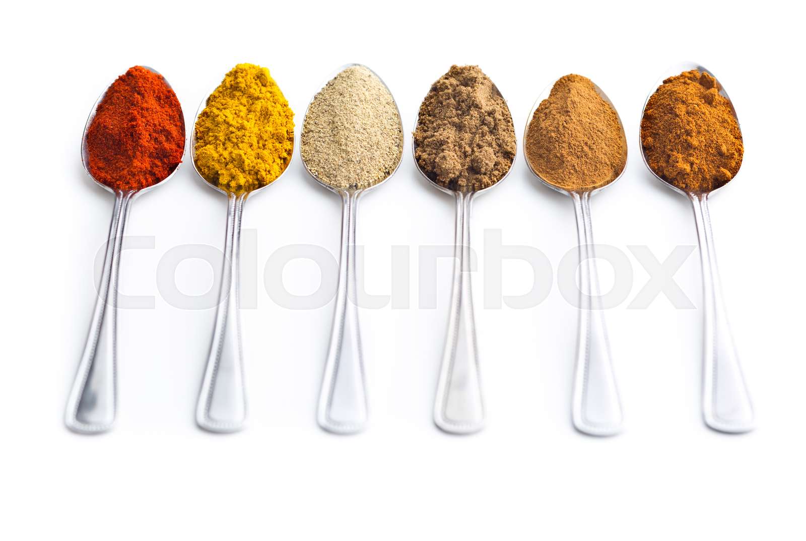 Various spices in spoons. Stock image Colourbox