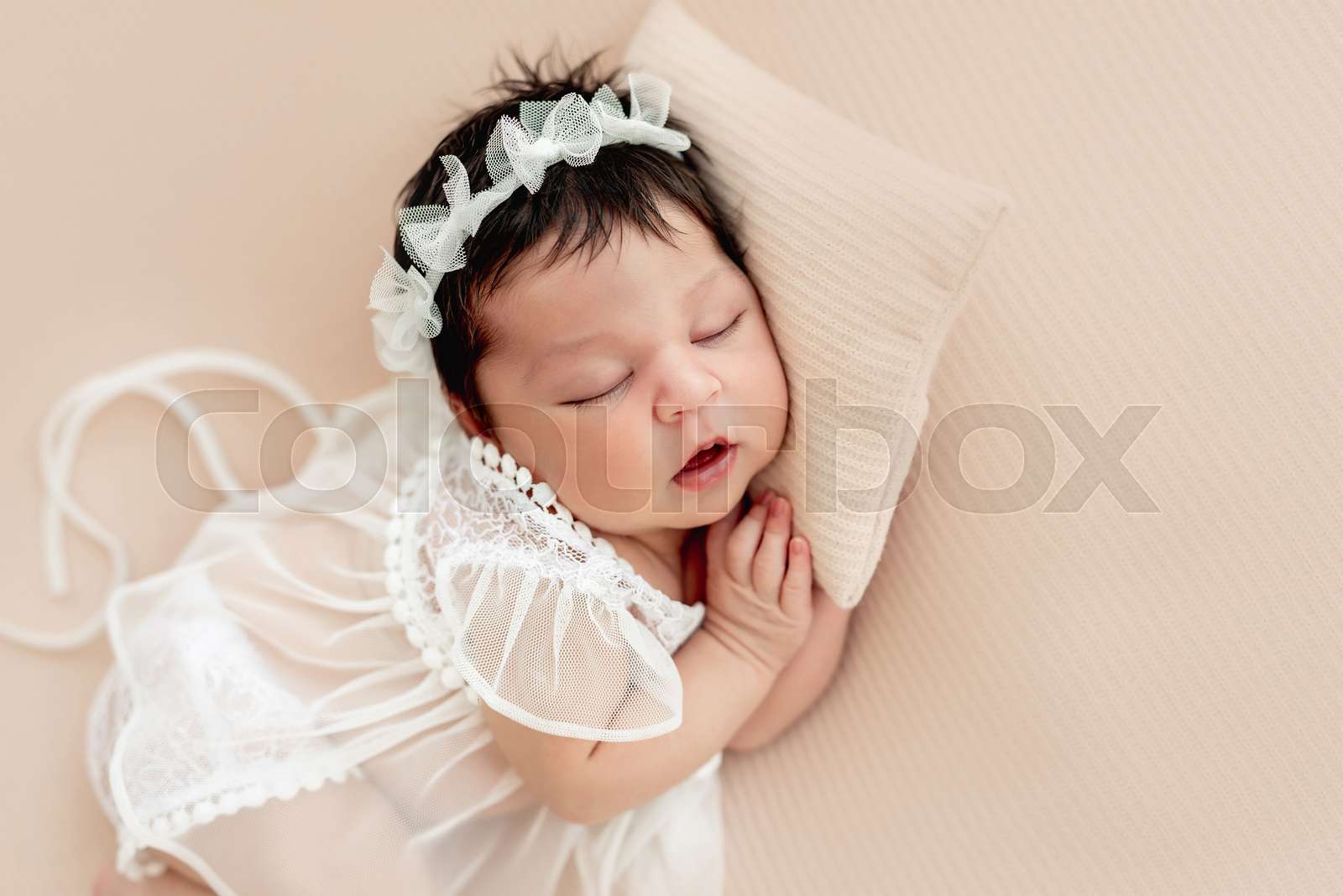 Cute newborn sleeping on side Stock image Colourbox