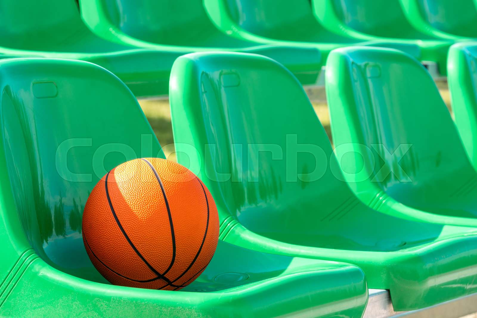 Stadium chairs with a basketball Stock image Colourbox