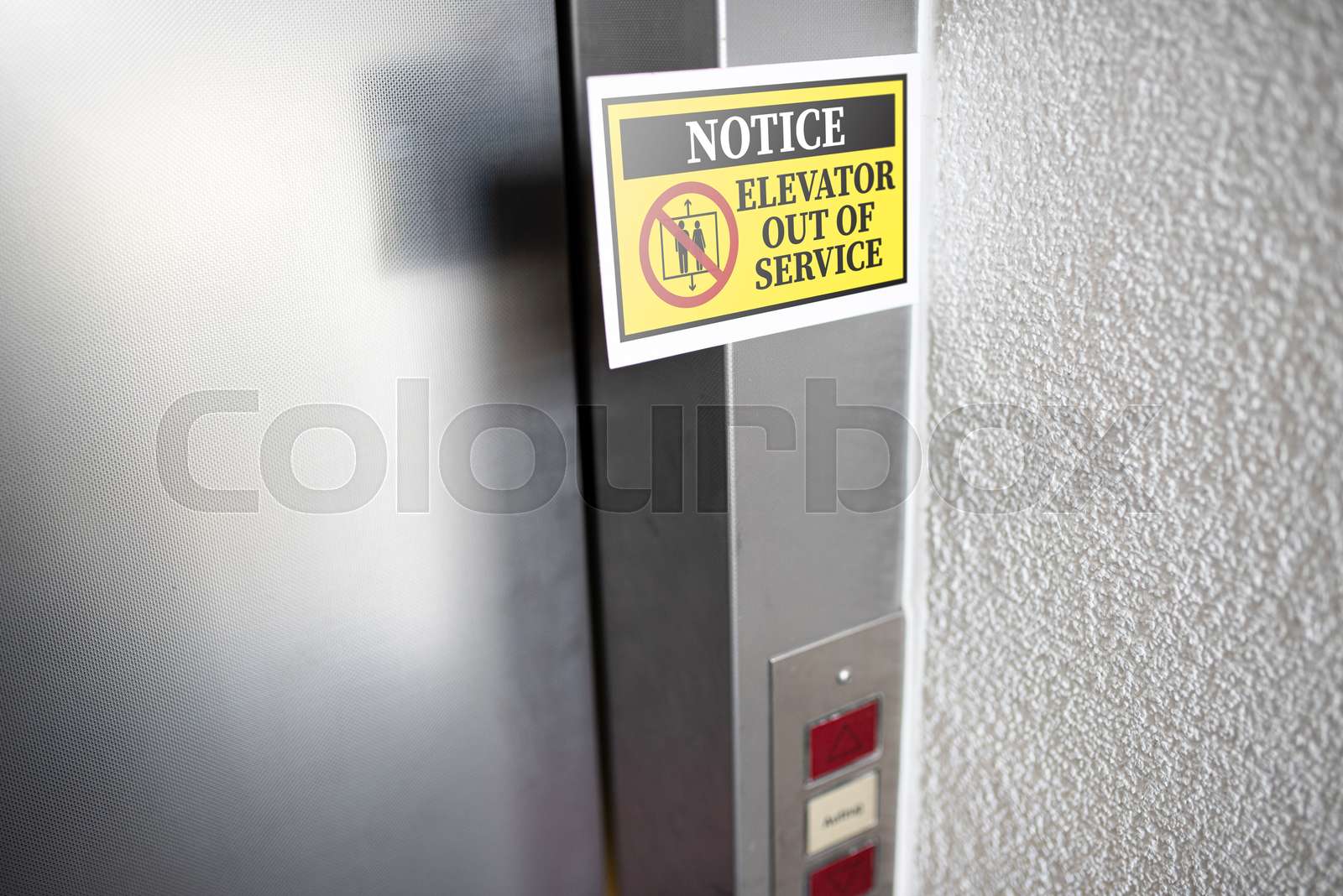 elevator out of service sign attached to elevator door | Stock image