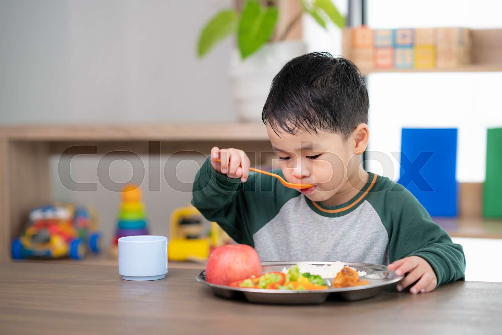Asian Student Take A Lunch In Class Room By Food Tray Prepared By His
