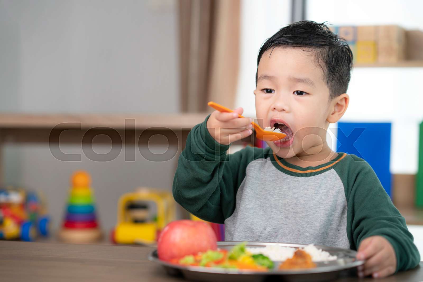Asian Student Take A Lunch In Class Room By Food Tray Prepared By His