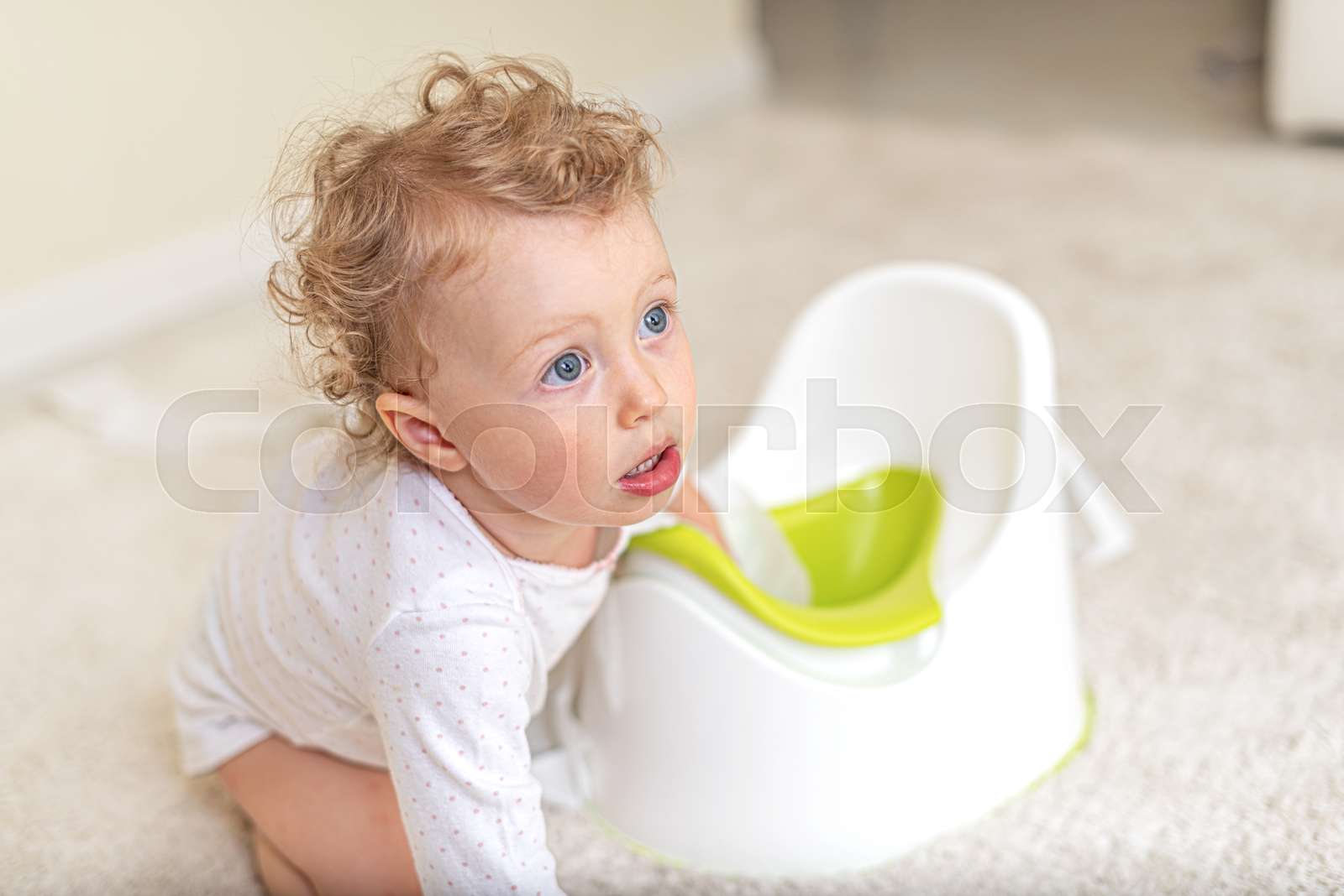Child girl on the potty. | Stock image | Colourbox