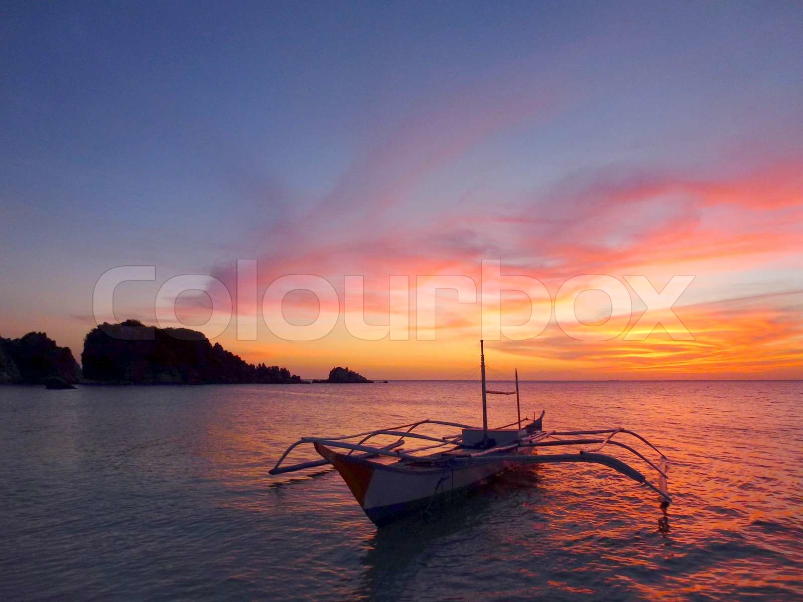 traditional filipino fishing boat at sunset | Stock image | Colourbox