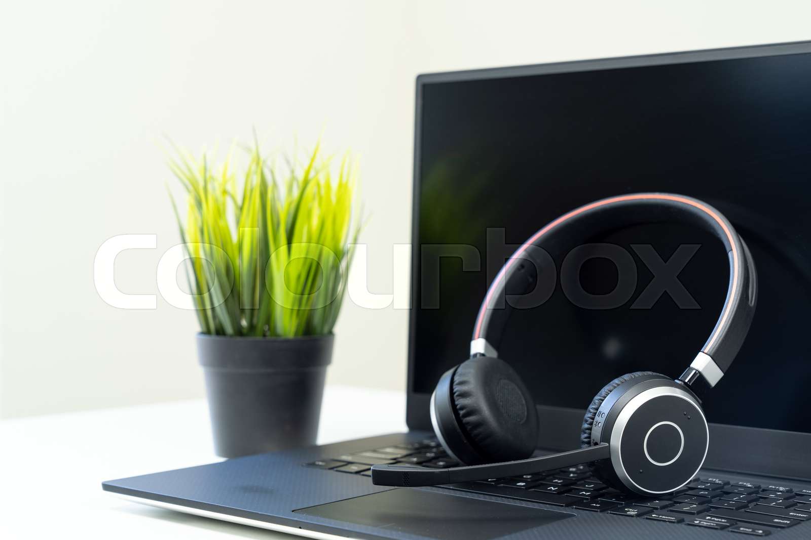 Headphone with laptop in office Stock image Colourbox