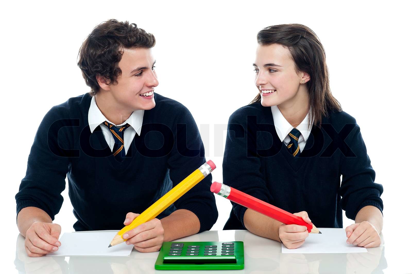 Classmates discussing the correct answer | Stock image | Colourbox