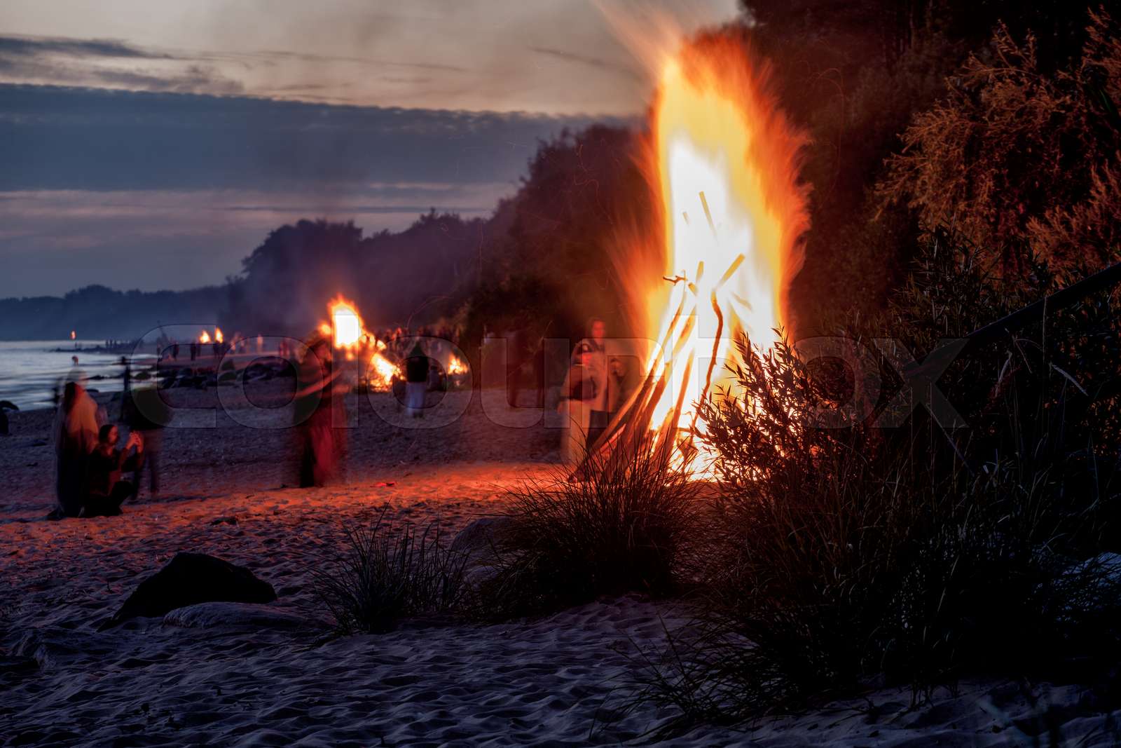 People Celebrating Summer Solstice with Bonfire