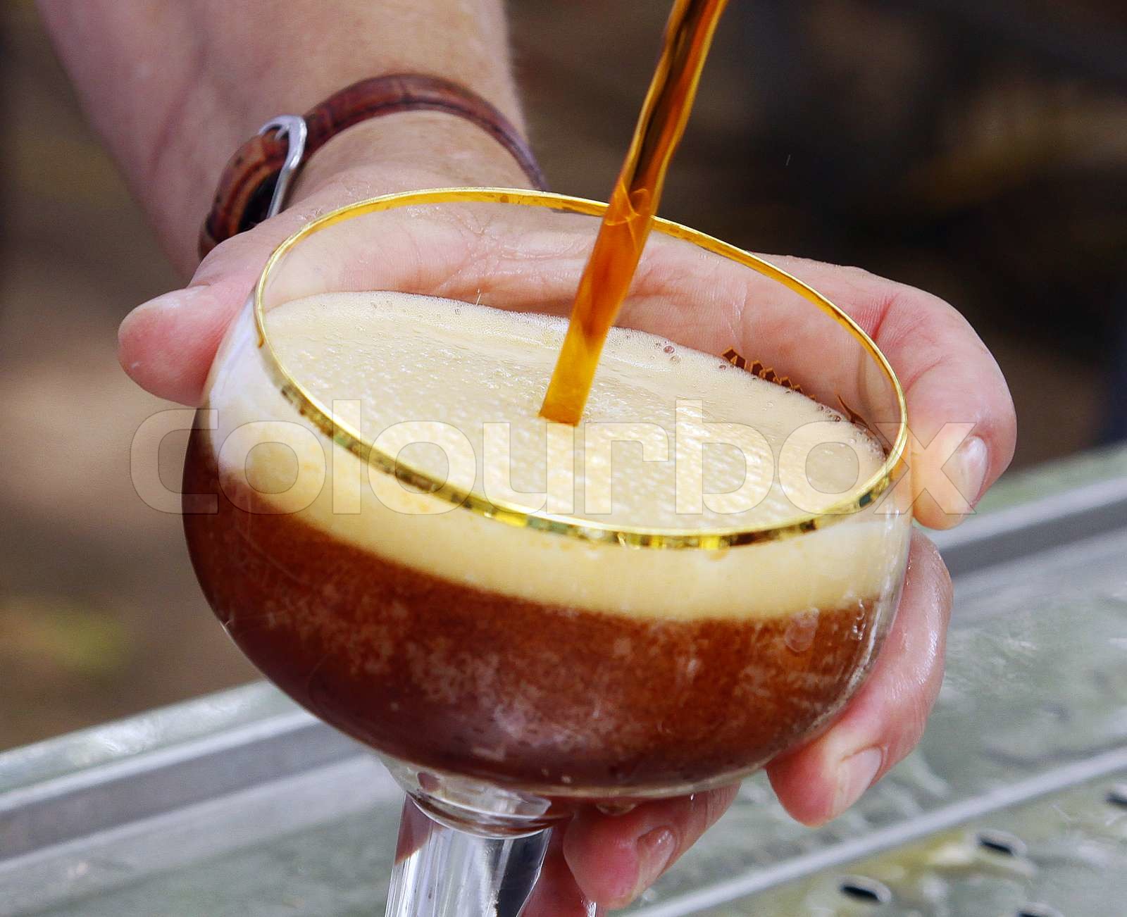 tapping a beer Stock image Colourbox