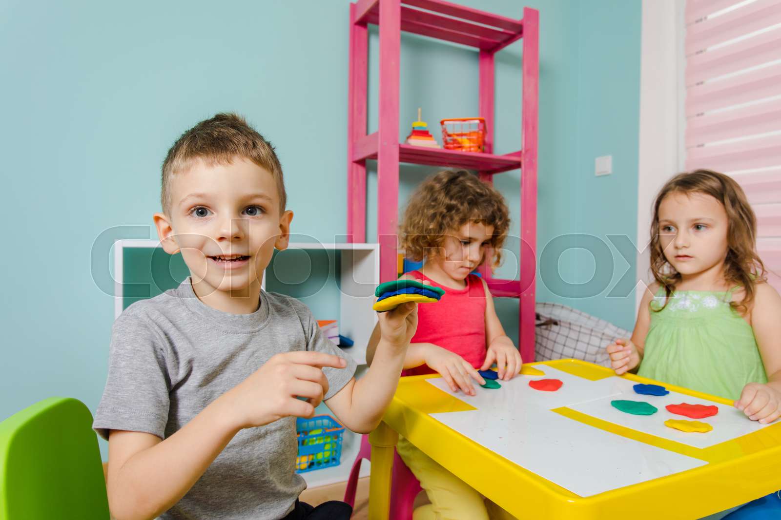 the child enjoys his work at the kindergarten | Stock image | Colourbox