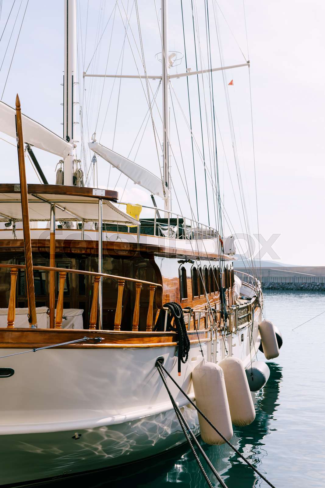 Vintage wooden sailing ship. The yacht is moored off the coast. Deck in ...