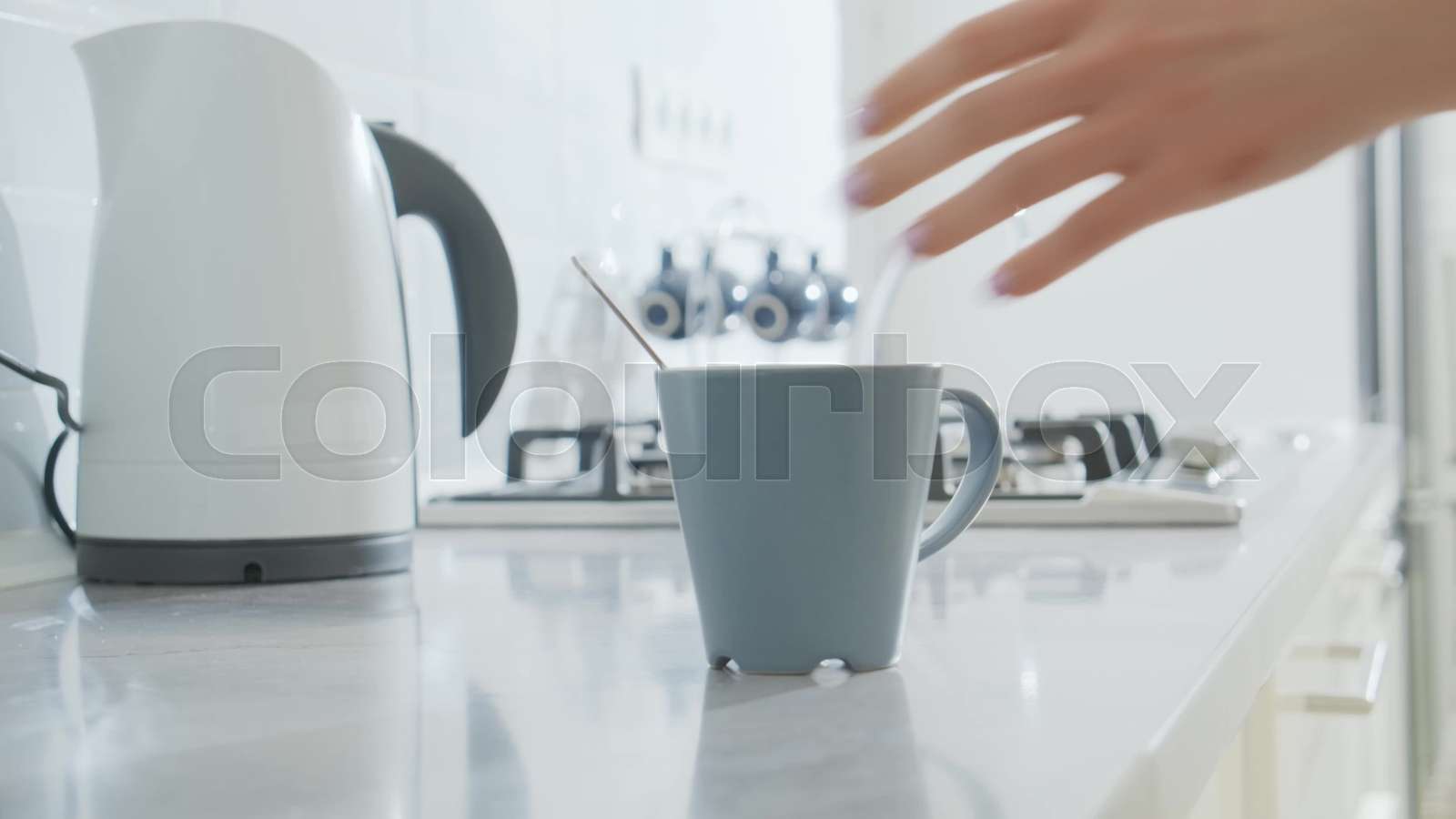 Close up of woman making coffee on kitchen | Stock video | Colourbox
