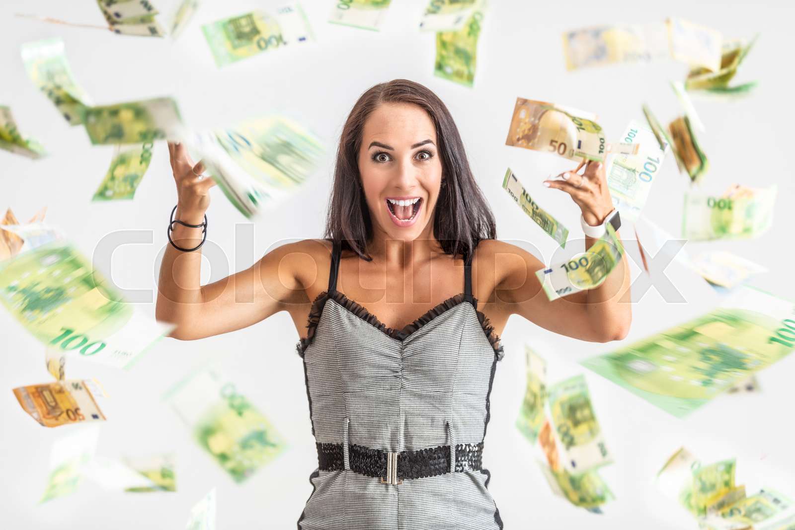Young woman throws around a lot of banknotes Stock image Colourbox