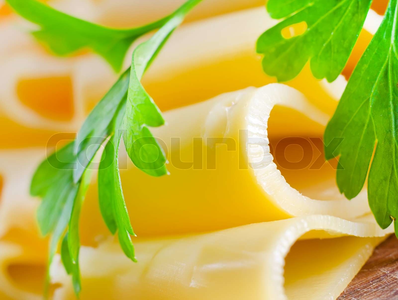 Cheese with the parsley, portion of the cheese Stock image Colourbox