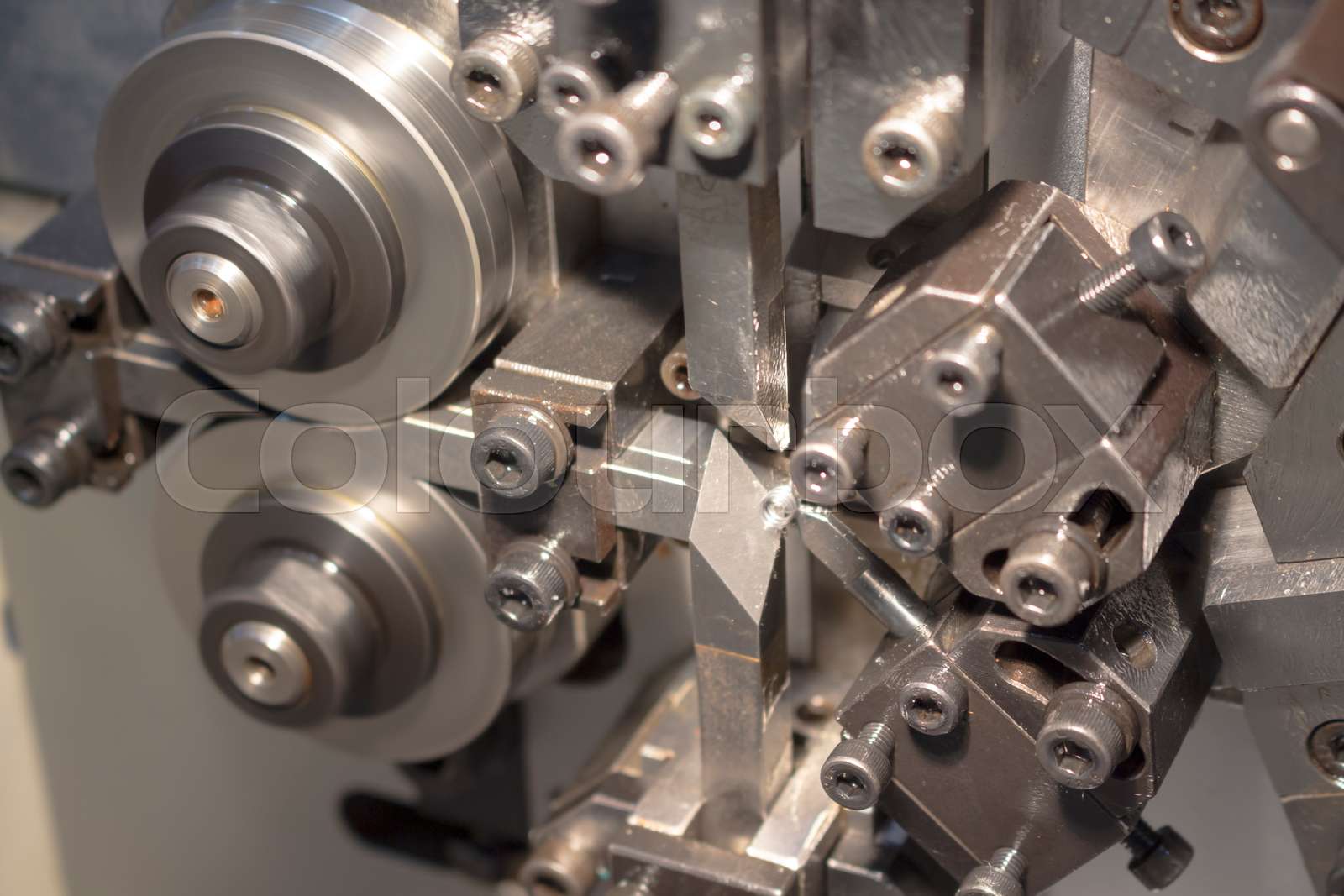 Blurred picture of small spring making machine | Stock image | Colourbox