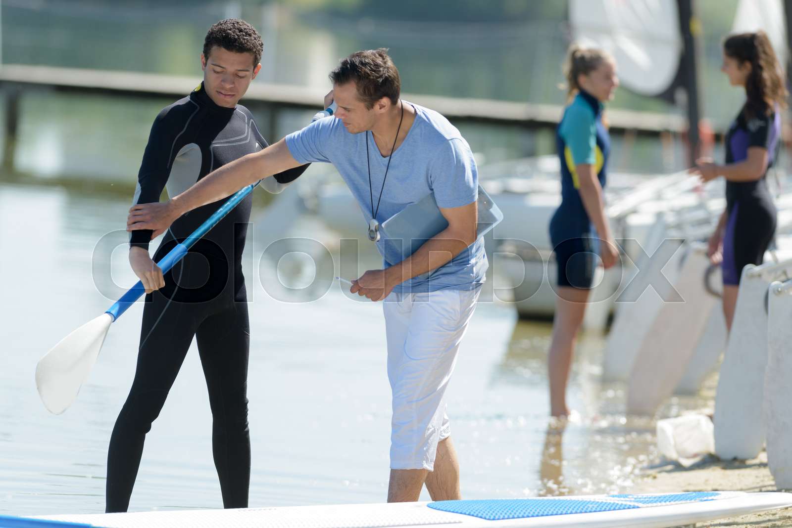 man during stand up paddle training Stock image Colourbox