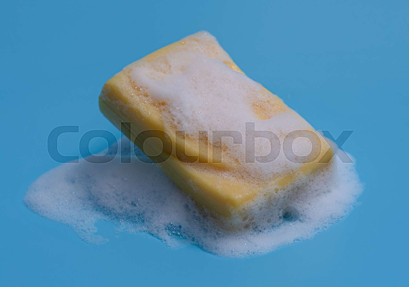 Soap bar and foam on blue background,Mockup for design | Stock image