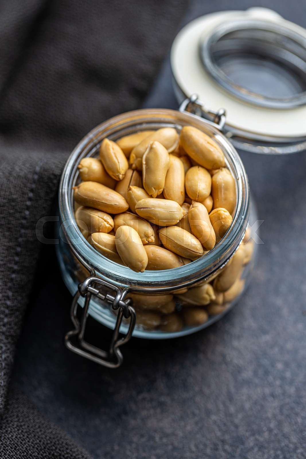 Roasted peeled peanuts in jar stock image colourbox