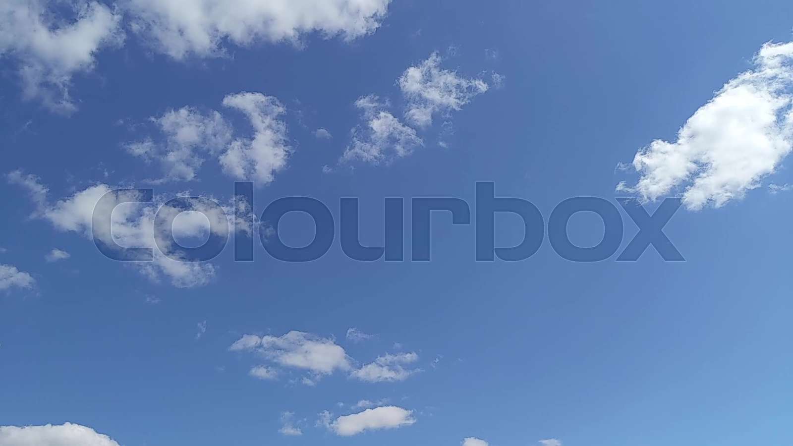 Clouds appear in the blue sky and disappear during the day. Timelapse