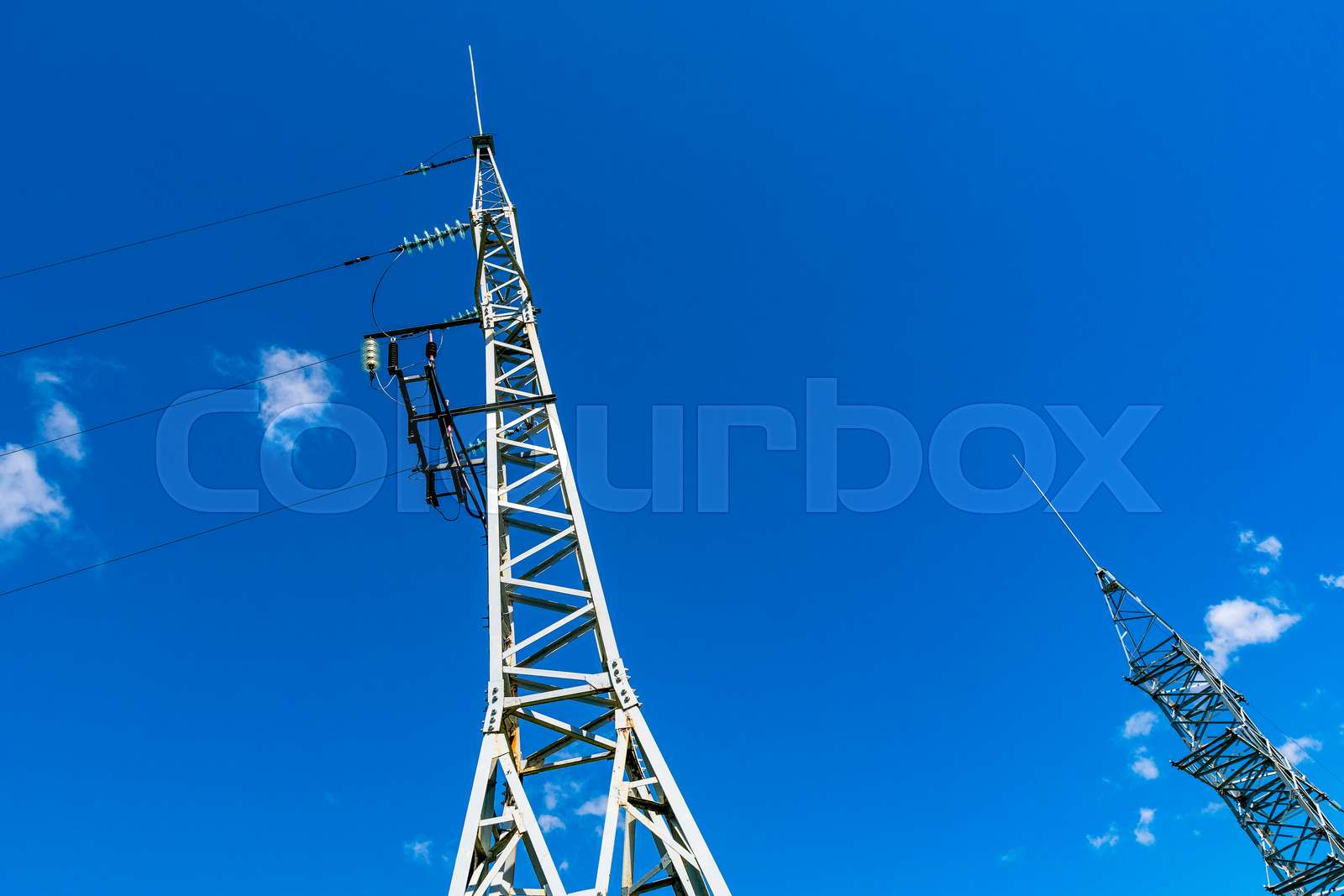 High voltage towers with electricity transmission power lines against ...