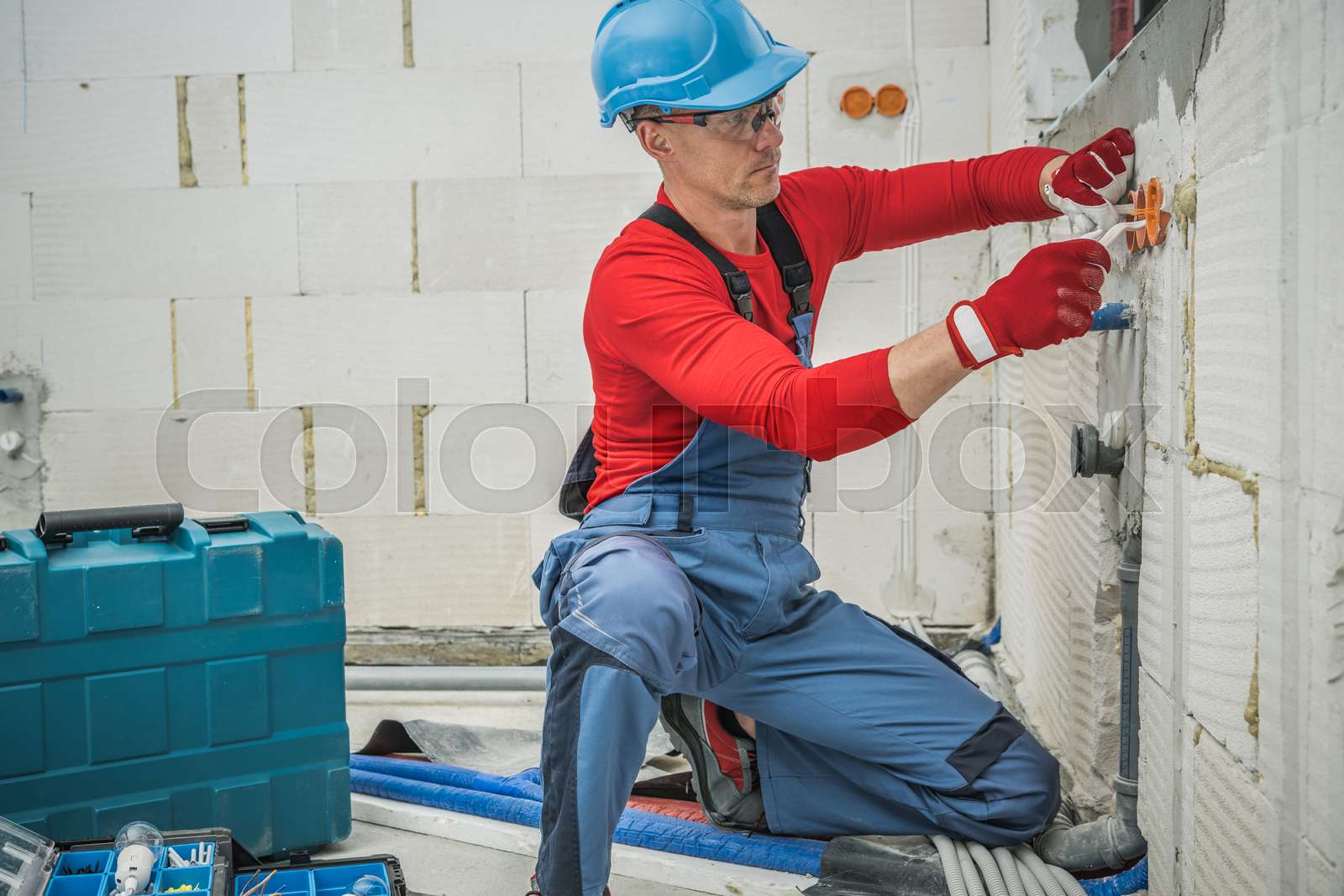 Professional Electrician Installing Power Plugs Stock image Colourbox