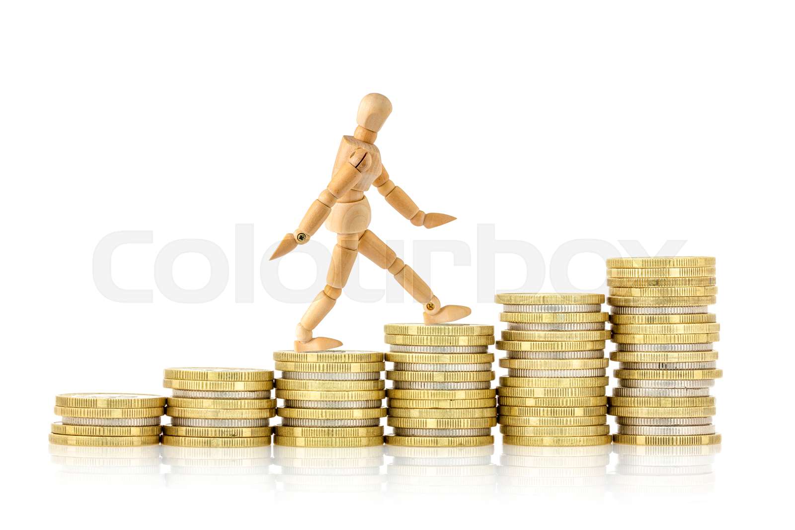 Wooden Dummy Goes Up The Gold Coins Stock Image Colourbox Wooden Dummy Goes Up The Gold Coins Stock Image Colourbox