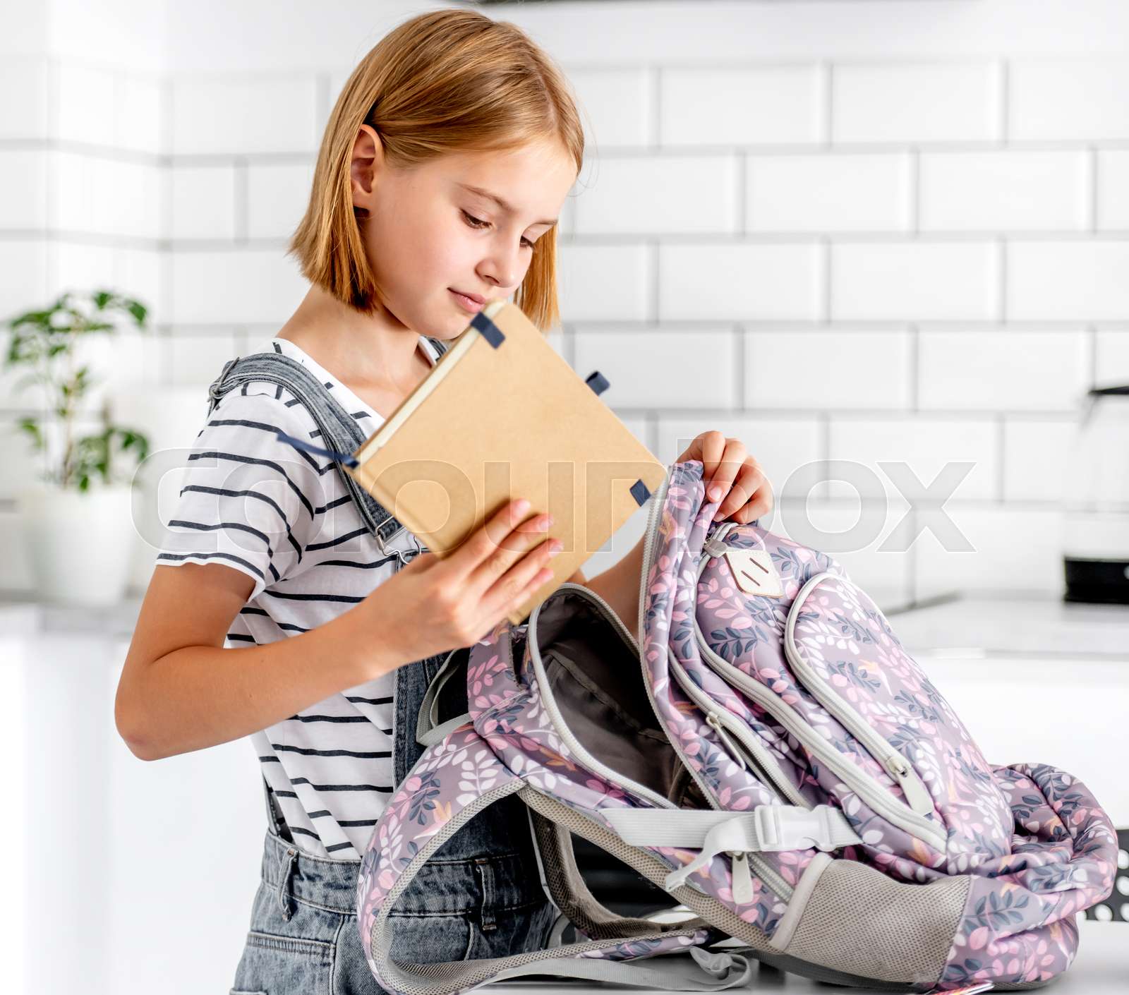 girl-preparing-backpack-stock-image-colourbox