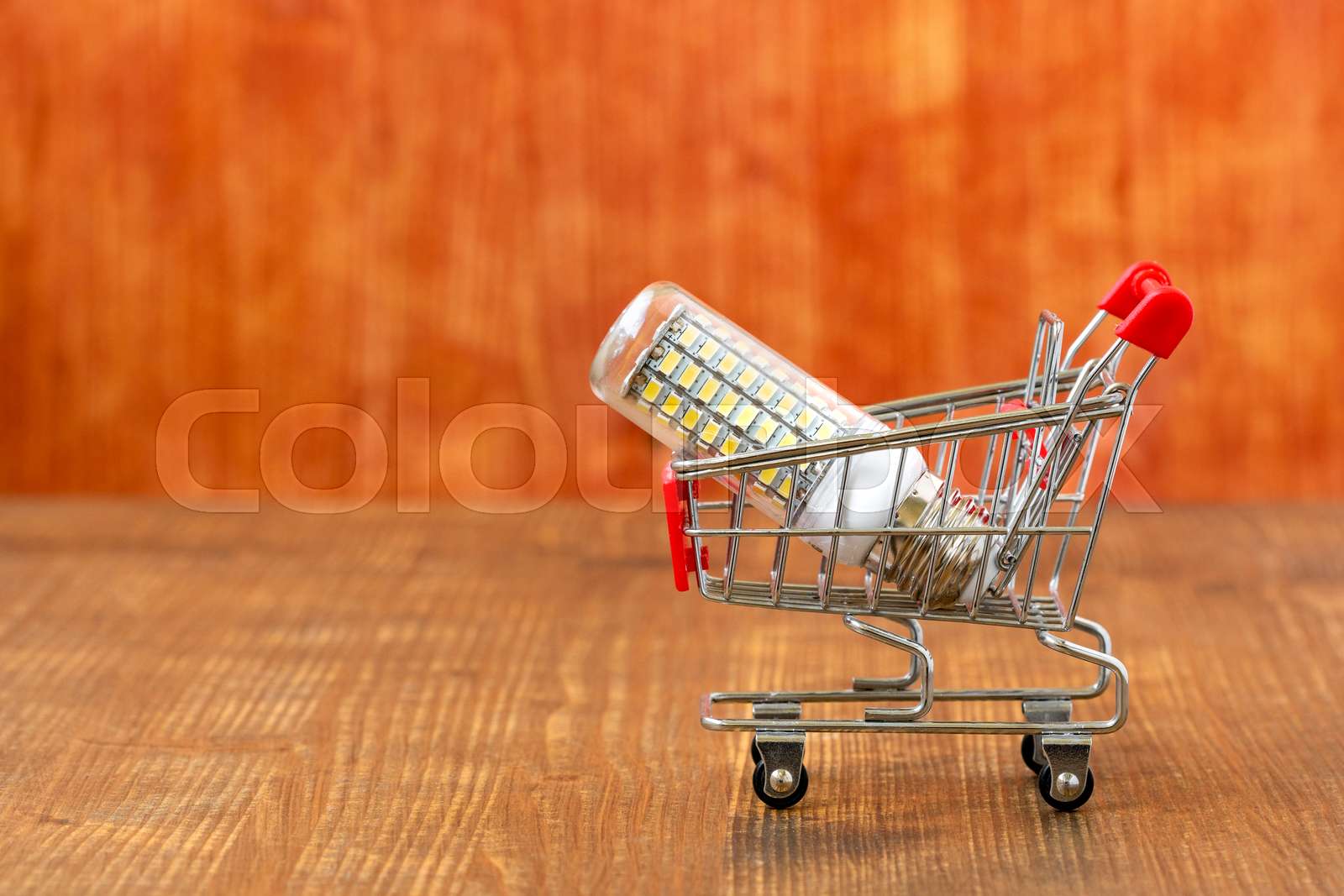 LED Light Bulb In Small Shopping Trolley Stock Image Colourbox led-light-bulb-in-small-shopping-trolley-stock-image-colourbox