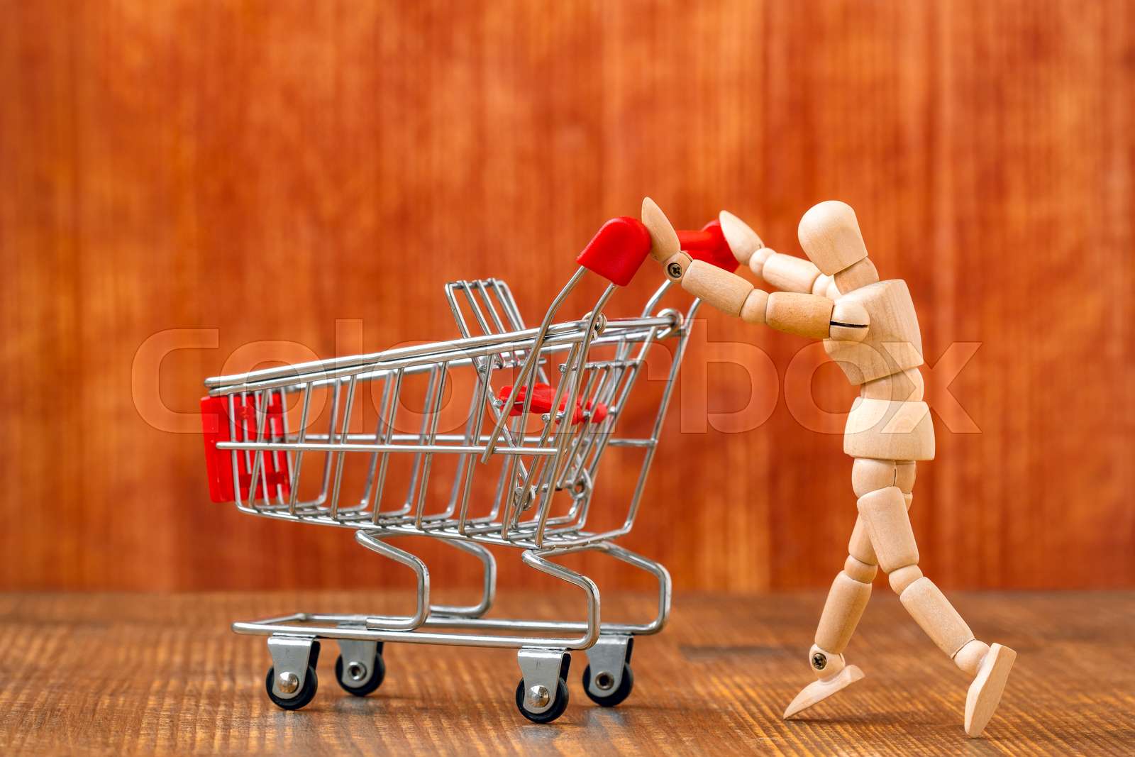 Customer with shopping cart Stock image Colourbox