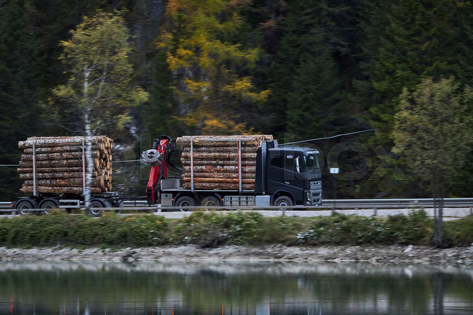 truck with tree logs in italy | Stock image | Colourbox