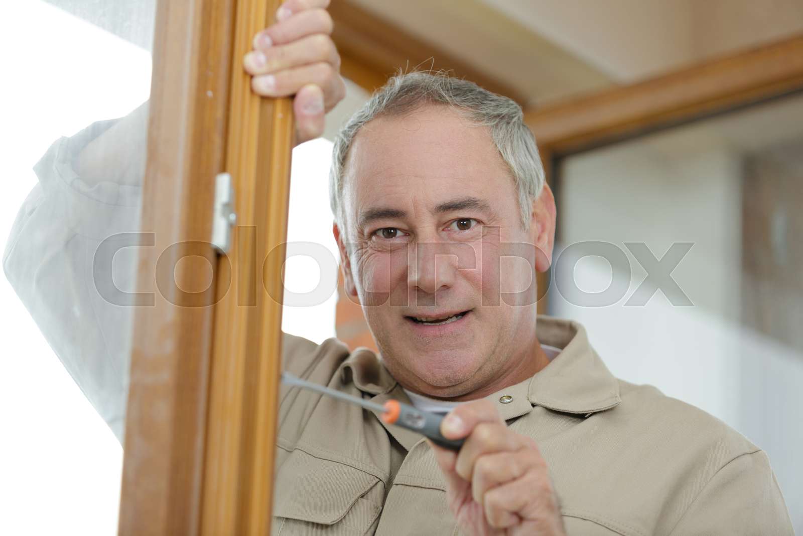 Men screwing screws window frame stock image colourbox