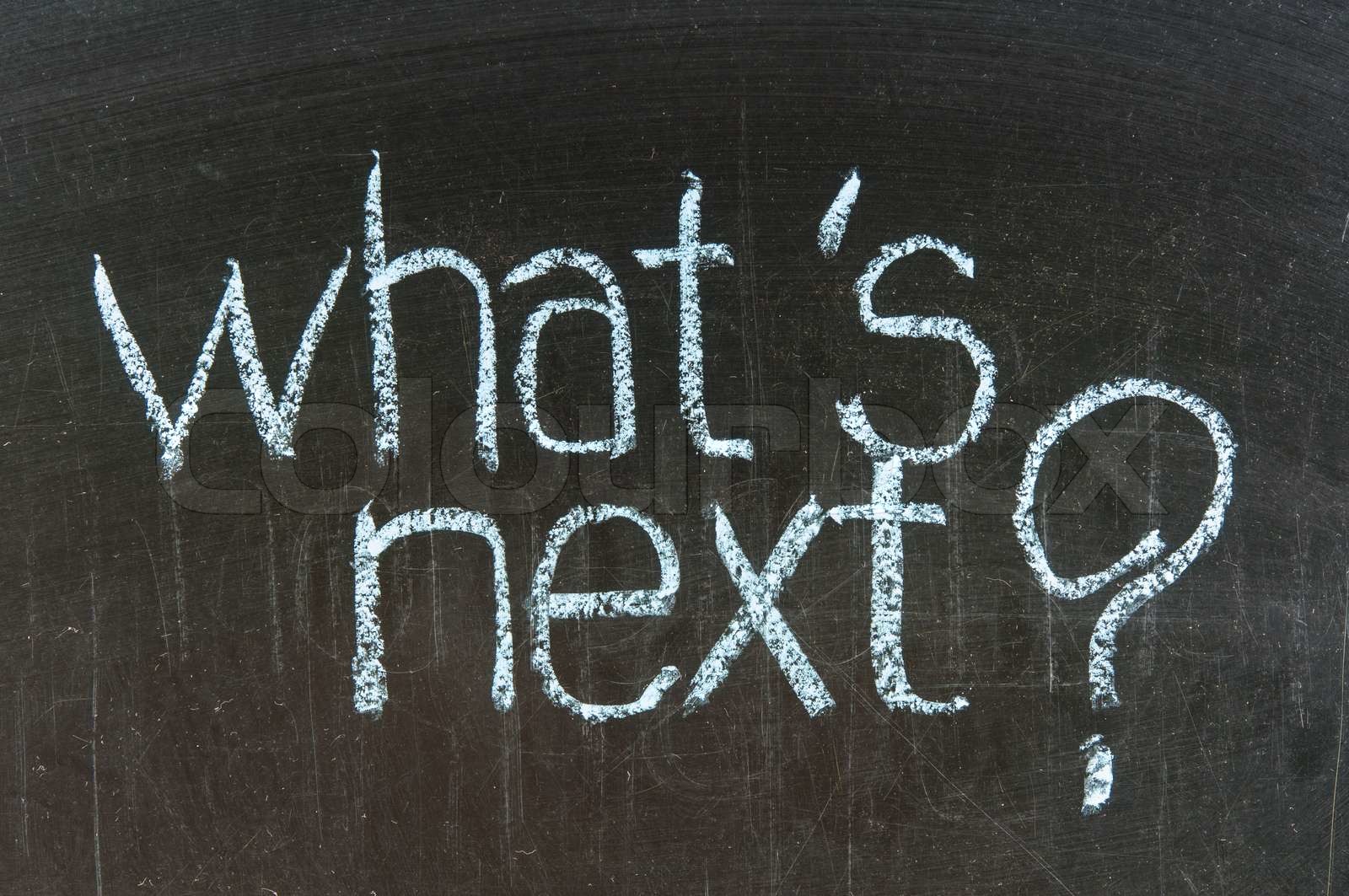 Chalk writing What's next words written on chalkboard Stock image