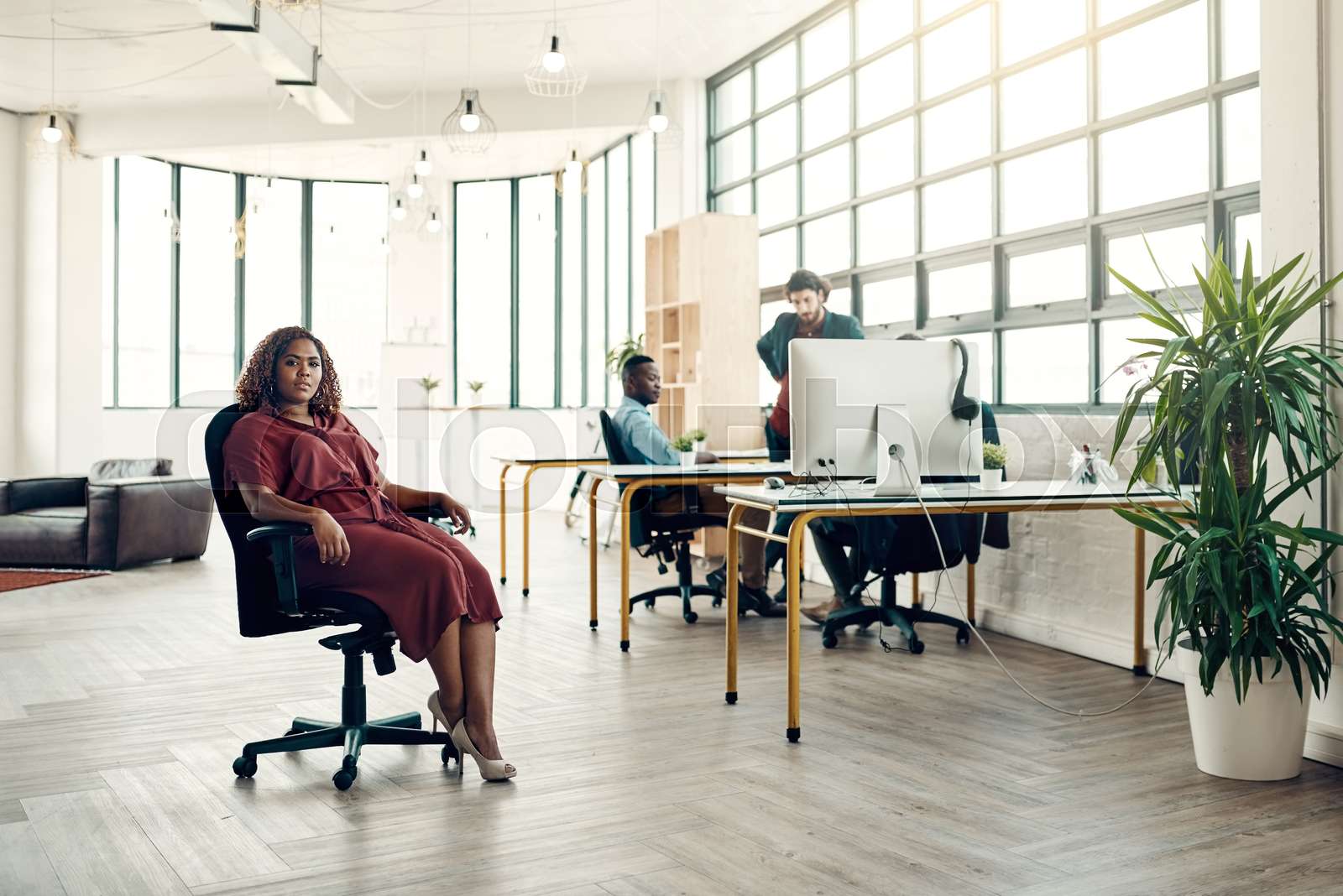 Portrait, pride and black woman in chair at office, boss with creative ...