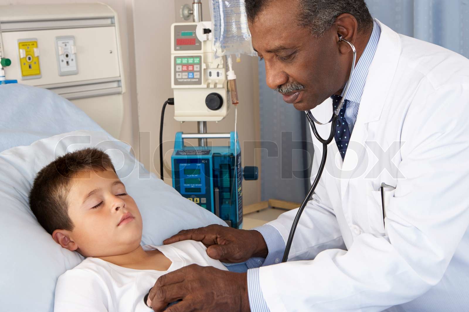 Doctor Examining Child Patient On Ward Stock Image Colourbox