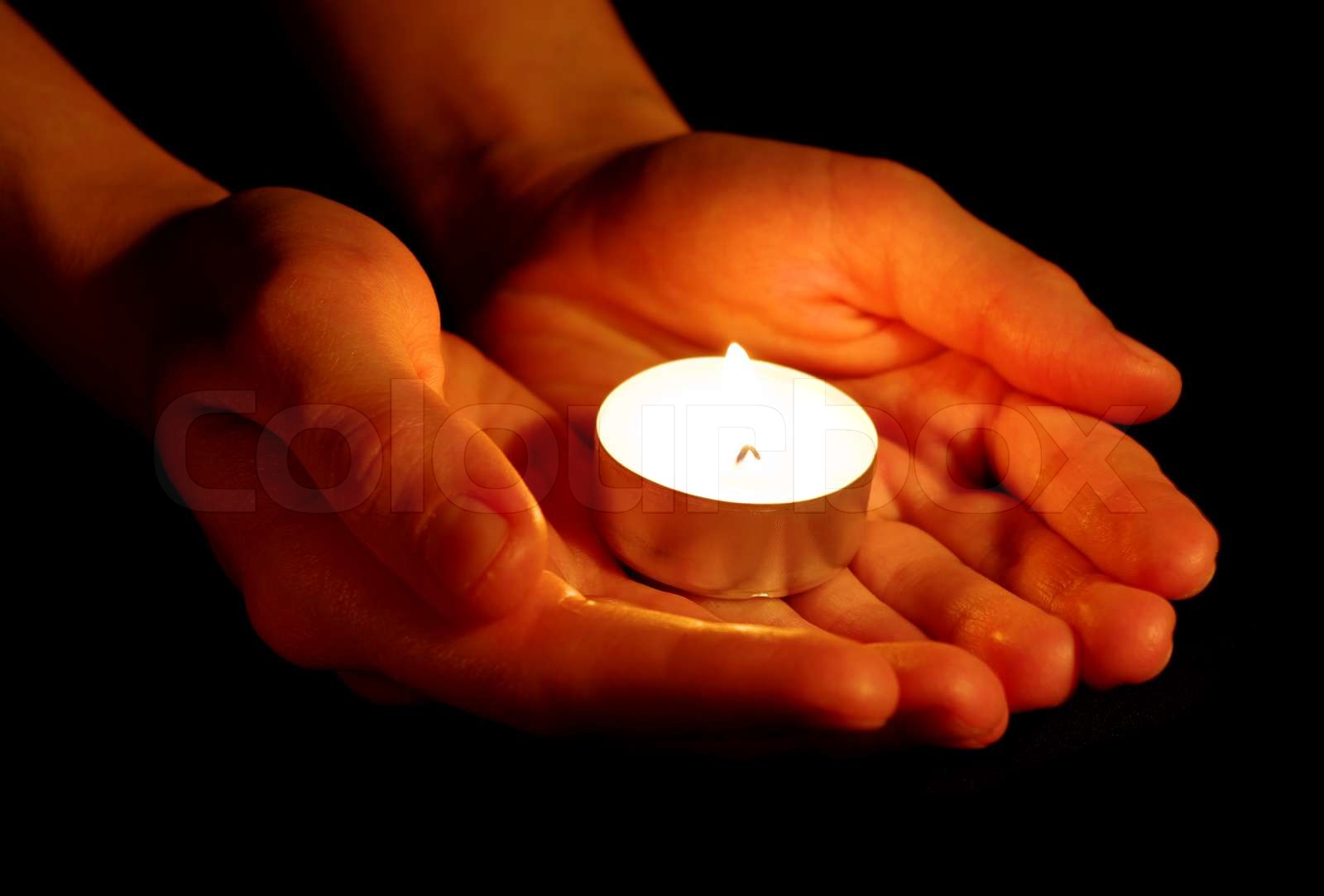 candle in a hand | Stock image | Colourbox