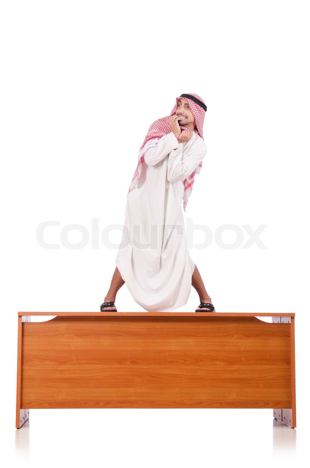 Arab man sitting at his desk | Stock image | Colourbox