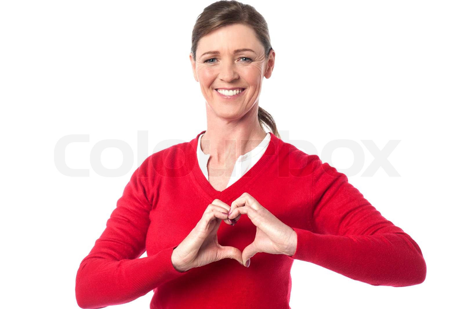 Frau, die HerzSymbol mit den Händen Stock Bild Colourbox