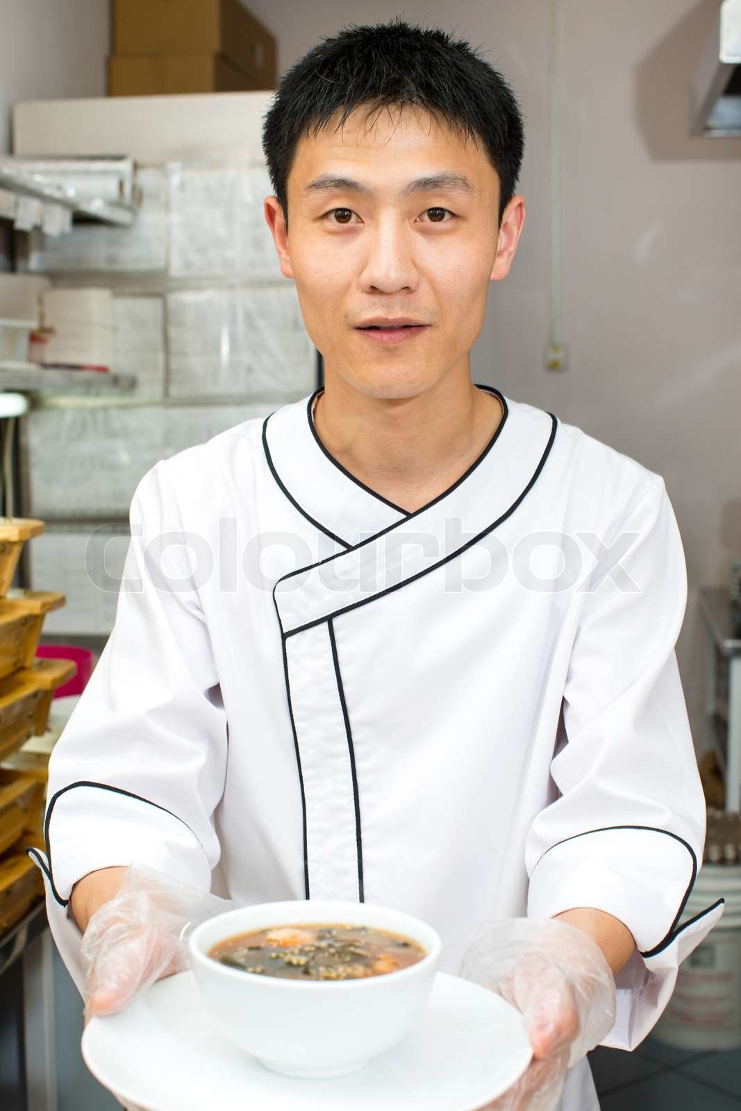 Japanese chef preparing a meal in a restaurant | Stock image | Colourbox