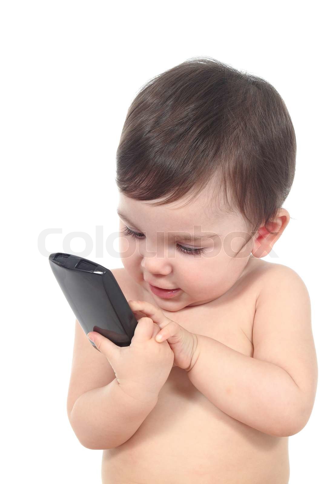 Smuk baby leger med en smart telefon | Stock foto | Colourbox