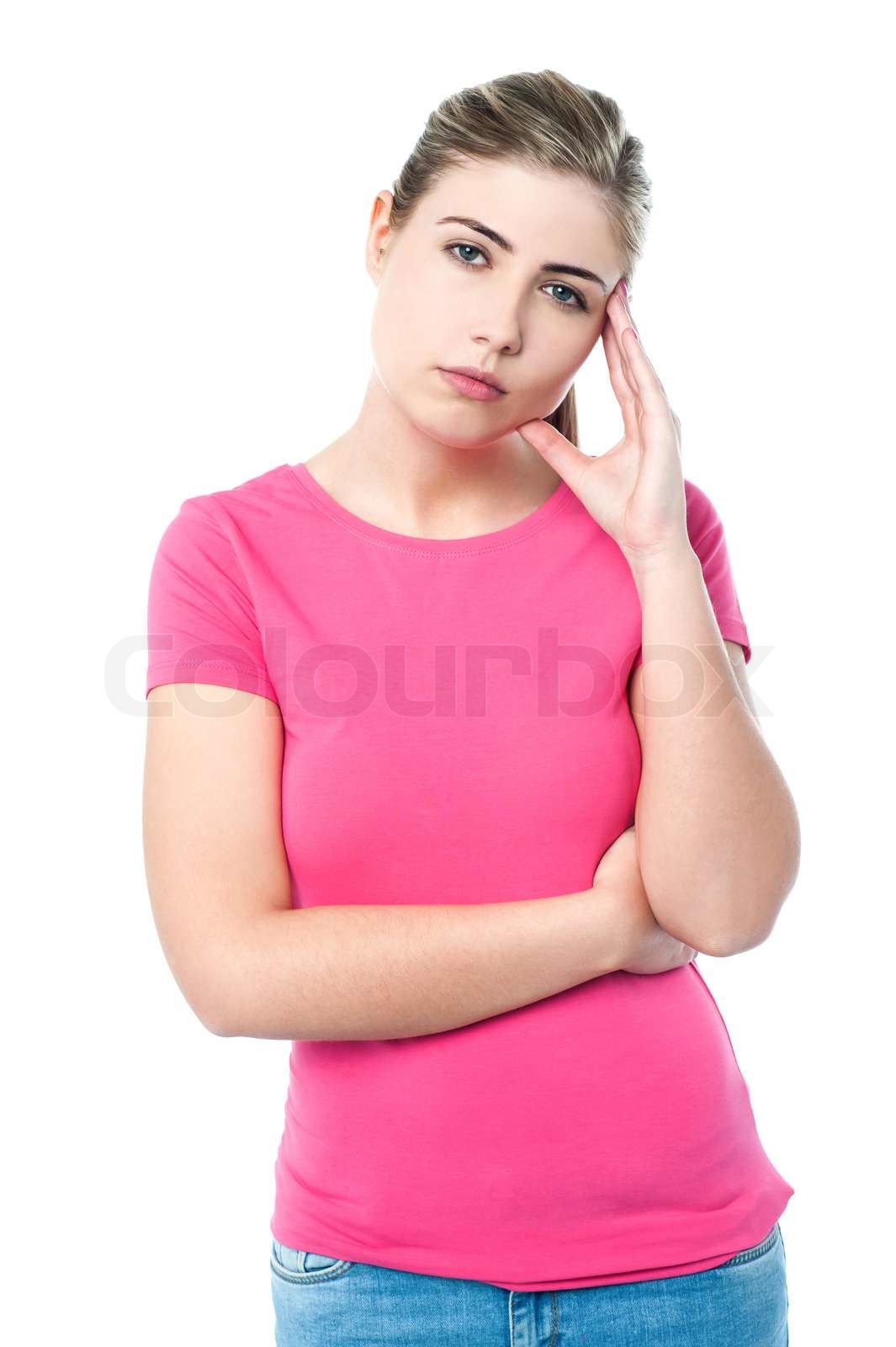 Confused pretty teenager thinking hard | Stock image | Colourbox