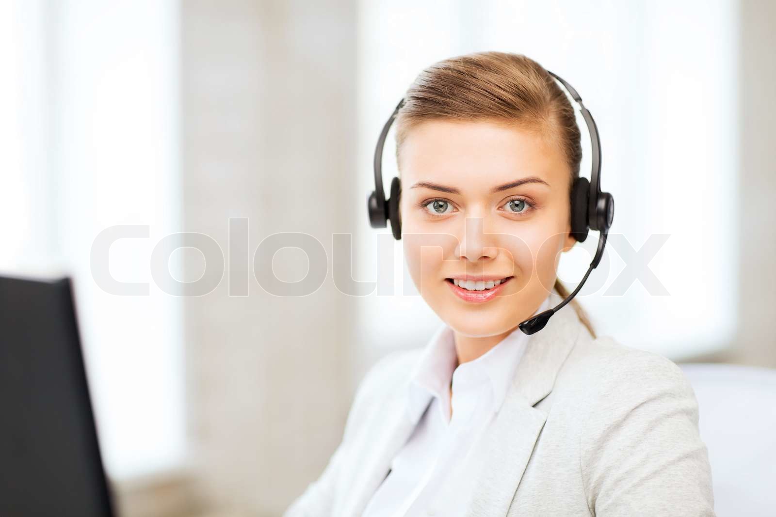 female helpline operator with headphones Stock image Colourbox