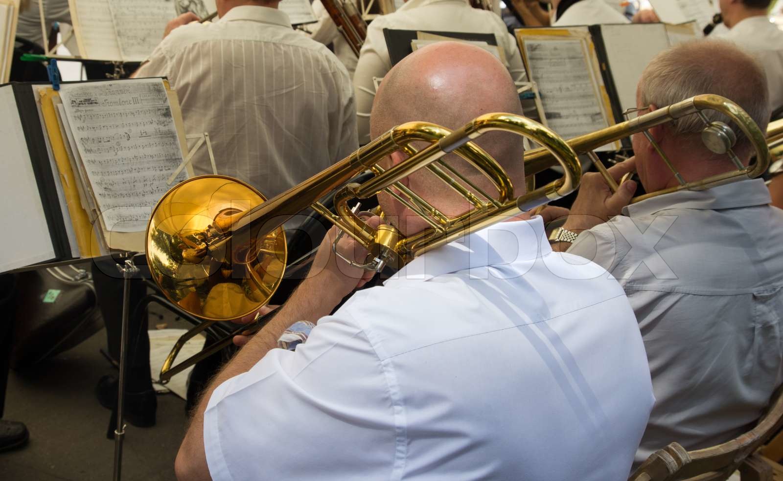 musician plays the trumpet in the orchestra Stock image Colourbox