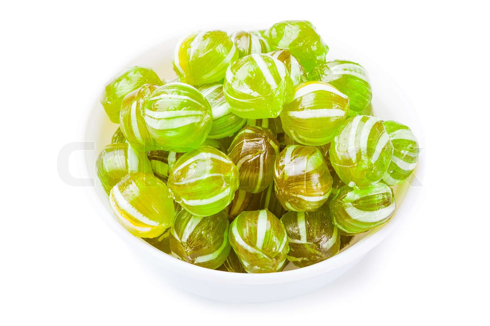 Ball shaped candy in bowl isolated on white Stock image Colourbox